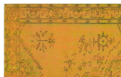 Load image 1 in gallery view. Mustard yellow vintage-style rug with a distressed dark green floral border and scattered abstract motifs.