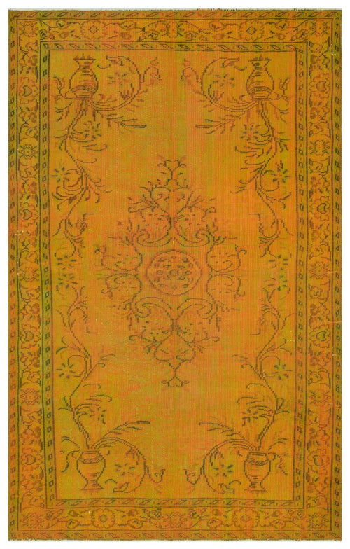 Load image 1 in gallery view. Mustard yellow vintage-style rug with a central floral medallion and ornate border in a dark, distressed outline.
