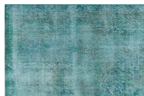 Load image 1 in gallery view. Teal and blue distressed rug with a faded, traditional medallion pattern.
