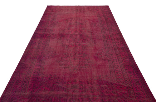 Load image 1 in gallery view. Deep magenta vintage-style rug with a faded, distressed traditional medallion pattern on a white background.