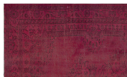Load image 1 in gallery view. Deep magenta rug with a distressed, faded black traditional border and ornate floral pattern.