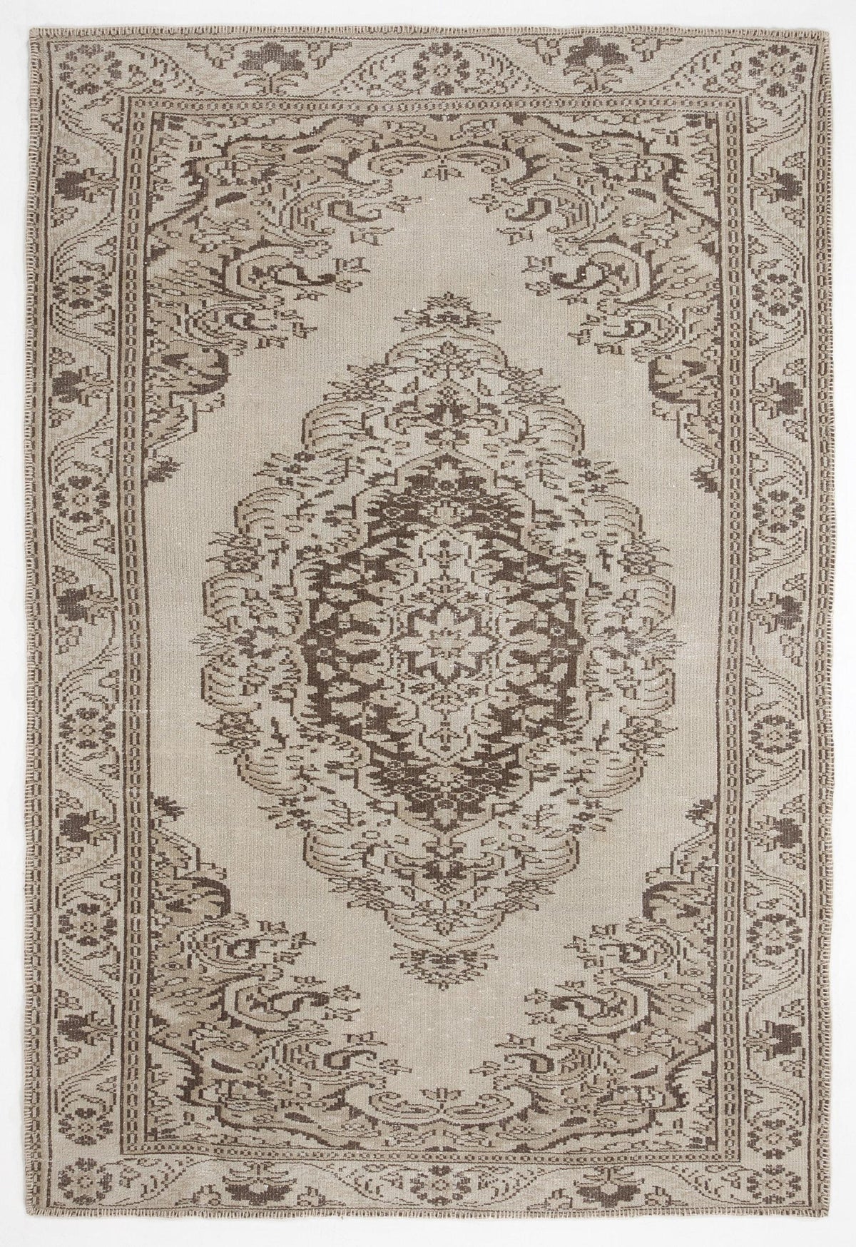 Beige and brown traditional rug with a central floral medallion and ornate border pattern on a white background.