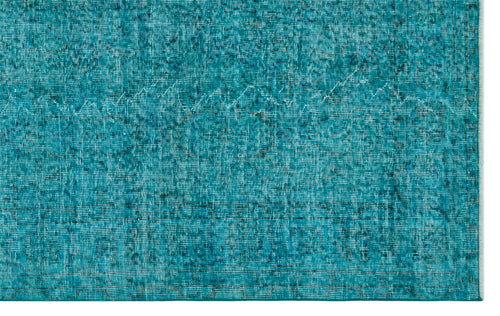 Load image 1 in gallery view. Teal distressed rug with a faded, intricate traditional pattern and a visible woven texture.