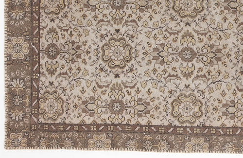 Load image 1 in gallery view. Beige and brown traditional rug with a floral medallion pattern and a detailed geometric border.