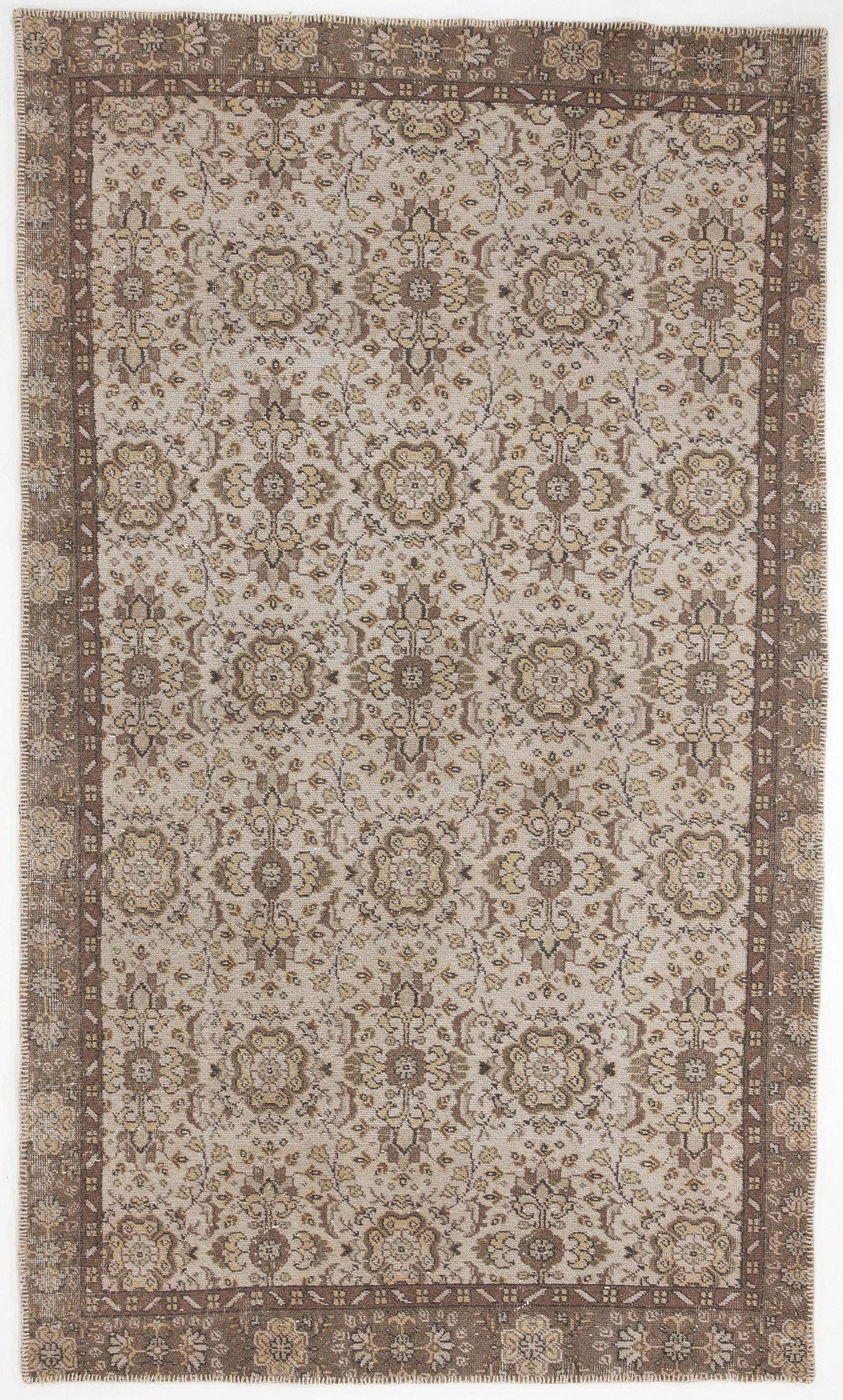 Beige and brown traditional rug with a repeating floral medallion pattern and a wide decorative border.