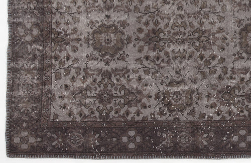 Load image 1 in gallery view. Charcoal and grey distressed rug with a traditional floral medallion pattern and a wide decorative border.