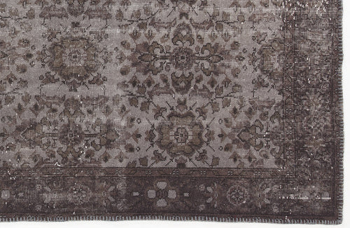 Load image 1 in gallery view. Dark grey and charcoal distressed rug with a traditional floral medallion pattern and a wide decorative border.