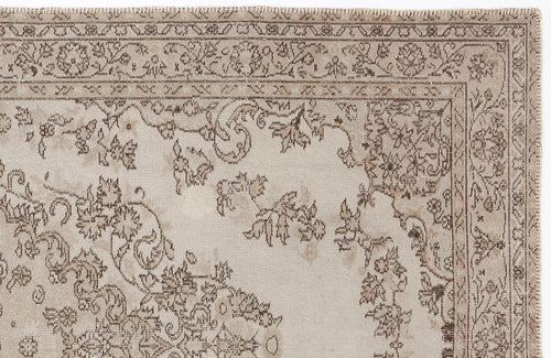 Load image 1 in gallery view. Beige and taupe area rug with a distressed traditional floral medallion pattern and a detailed border.