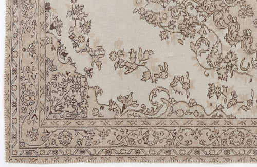Load image 1 in gallery view. Beige and taupe traditional rug with a distressed floral medallion pattern and a detailed geometric border.