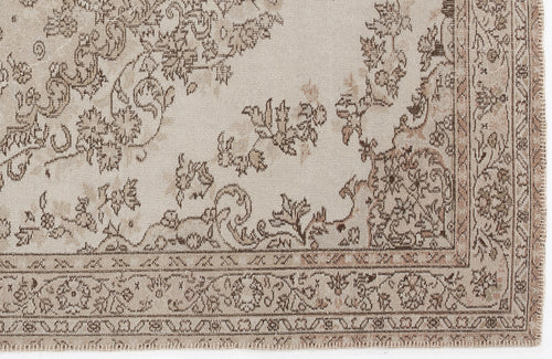 Load image 1 in gallery view. Beige and brown rug with a distressed floral medallion pattern and a detailed decorative border.
