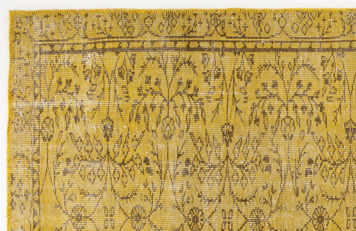 Load image 1 in gallery view. Mustard yellow and brown distressed rug with a traditional floral vine pattern and a linear border.