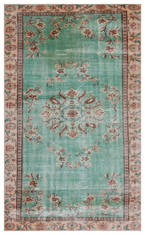 Load image 1 in gallery view. Distressed teal rug with a central floral medallion and tan border, featuring a faded traditional pattern.