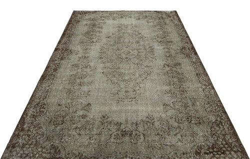Load image 1 in gallery view. Distressed grey and brown rug with a traditional central medallion and ornate floral border.