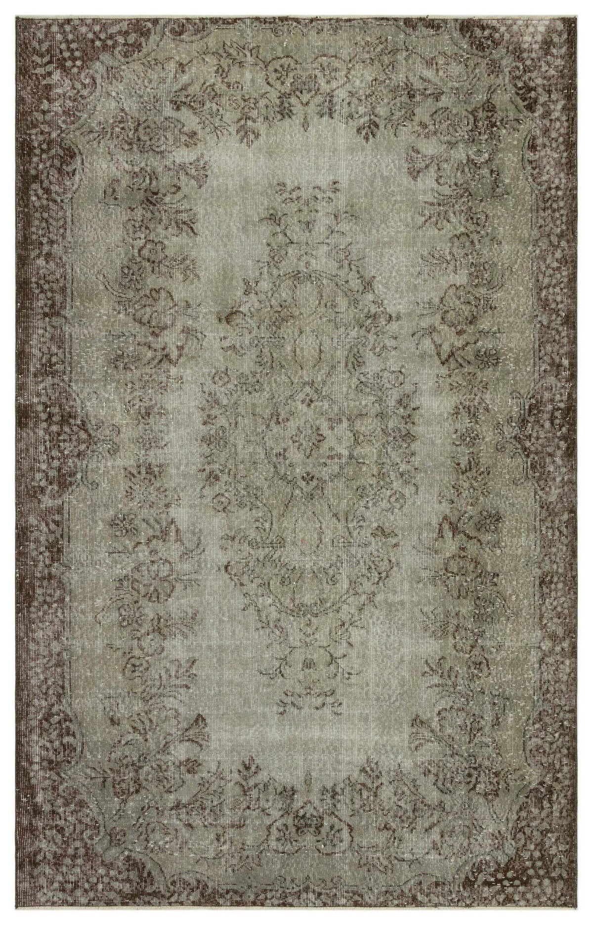 Distressed sage green and brown rug with a traditional floral medallion pattern and ornate border.