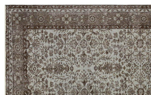 Load image 1 in gallery view. Brown and light gray traditional rug with a distressed floral medallion pattern and a decorative border.