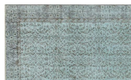 Load image 1 in gallery view. Light blue and charcoal grey rug with a distressed traditional floral medallion pattern and a wide border.