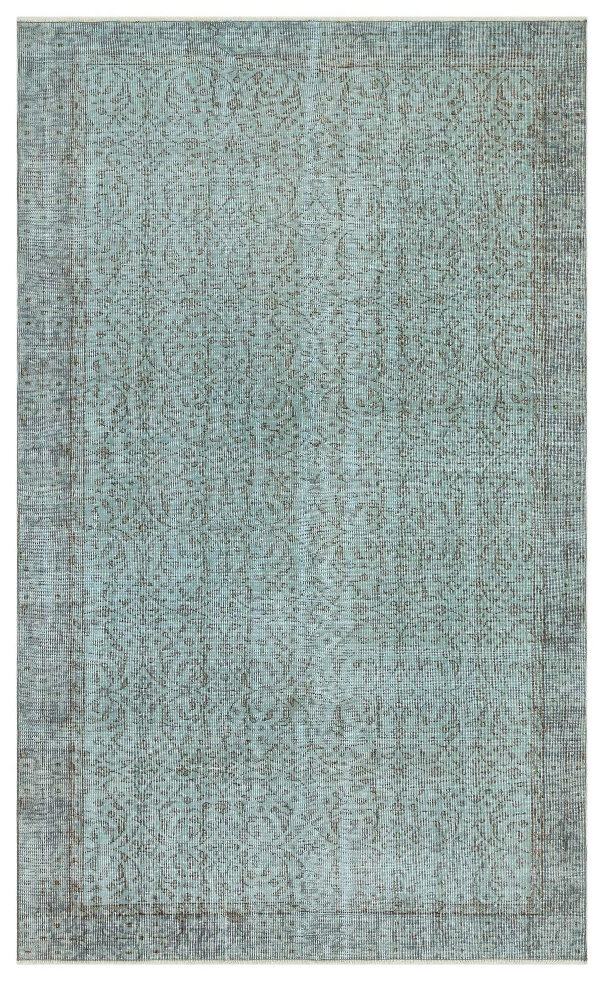 Light blue and grey distressed rug with a traditional floral vine pattern and a bordered edge.