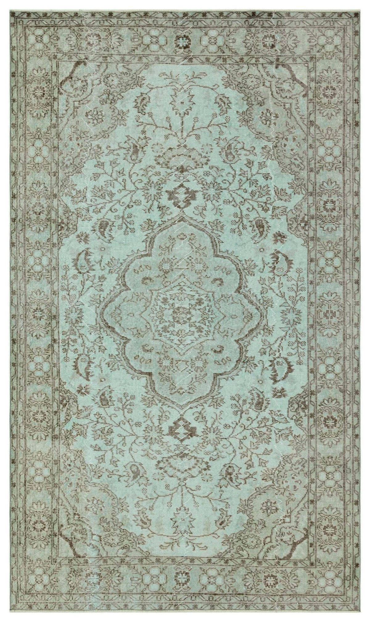 Light blue and brown traditional rug with a central floral medallion and ornate border pattern.