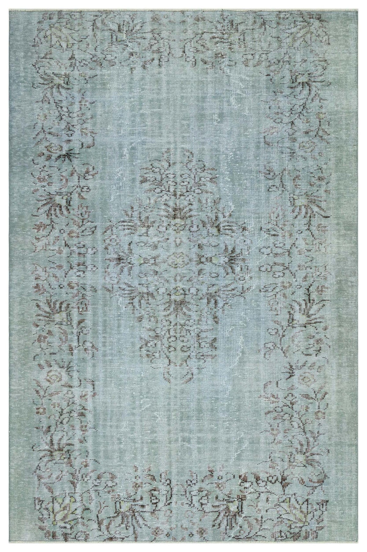 Light blue distressed rug with a central floral medallion and a matching botanical border in muted brown tones.