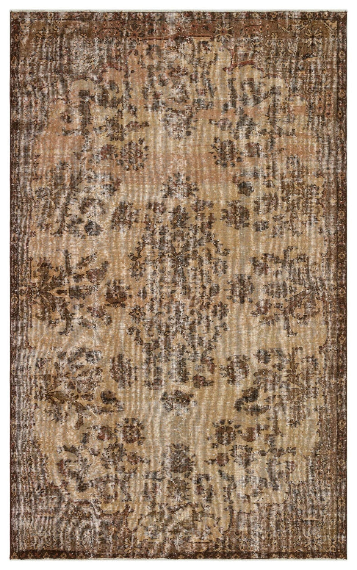 Distressed tan and brown vintage-style rug with a central floral medallion and ornate border.