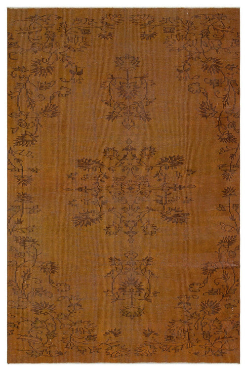 Load image 1 in gallery view. Tobacco brown rug with a dark brown floral medallion and vine border pattern.