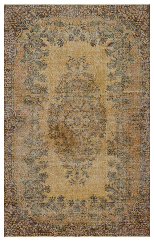 Load image 1 in gallery view. Distressed tan and brown traditional rug with a central floral medallion and ornate border.