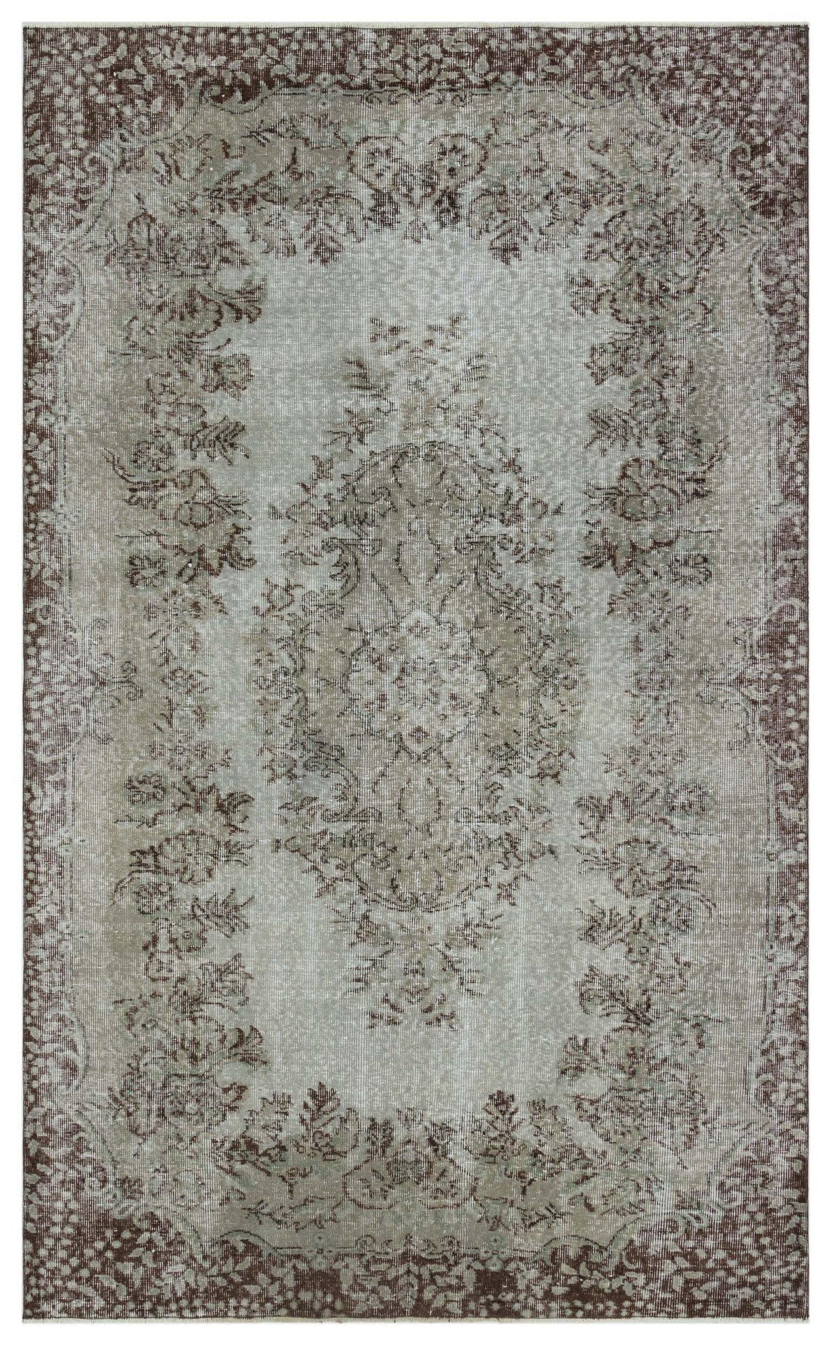 Distressed taupe and grey traditional rug with a central floral medallion and ornate border.