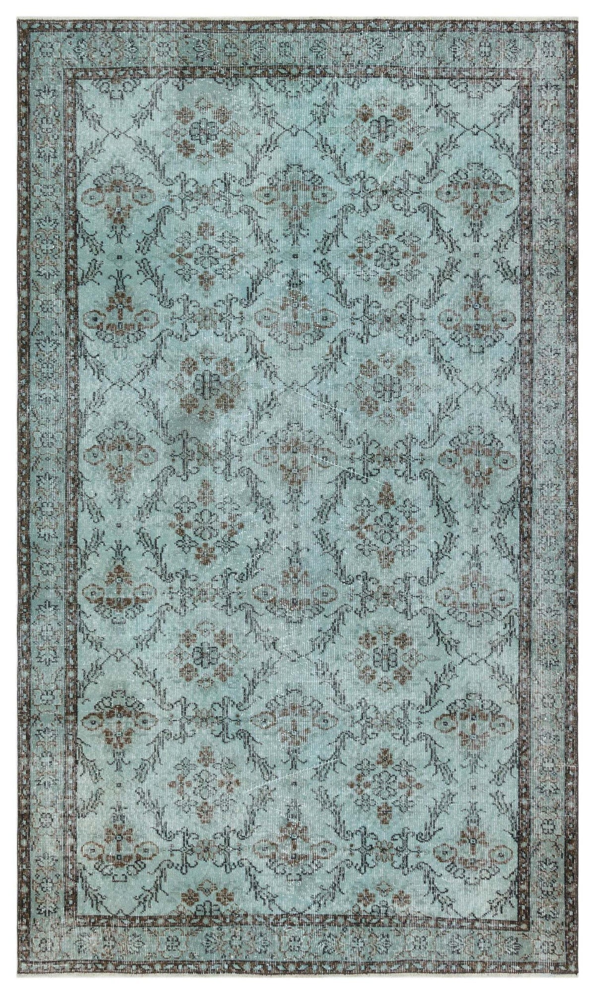 Light blue distressed rug with a dark brown floral medallion pattern and a geometric lattice border.