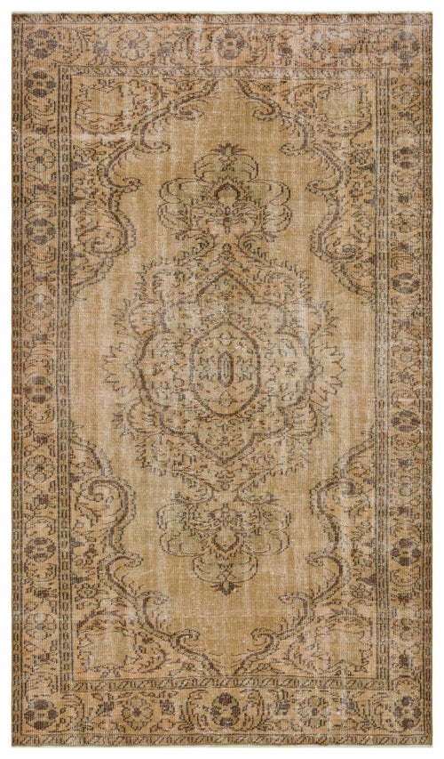 Load image 1 in gallery view. Tan and brown distressed traditional rug with a central floral medallion and ornate border.