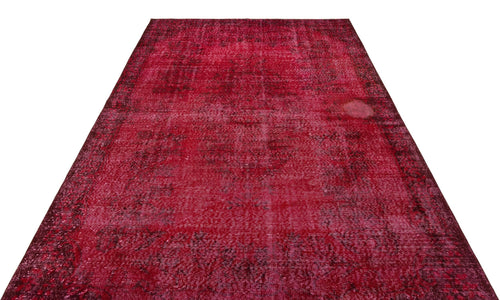 Load image 1 in gallery view. Deep red vintage-style rug with a distressed, faded traditional medallion pattern on a white background.