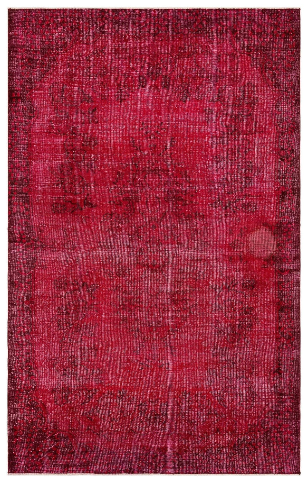 Deep magenta distressed rug with a faded traditional floral medallion pattern on a white background.