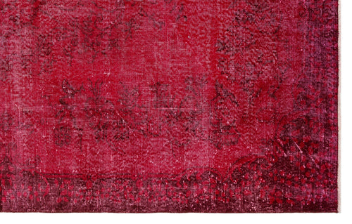 Load image 1 in gallery view. Deep red vintage-style rug with a distressed, faded floral medallion pattern and dark burgundy border.