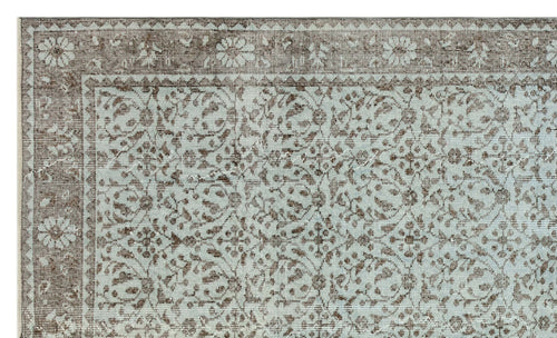 Load image 1 in gallery view. Light blue and brown rug with a traditional floral medallion pattern and a detailed border.