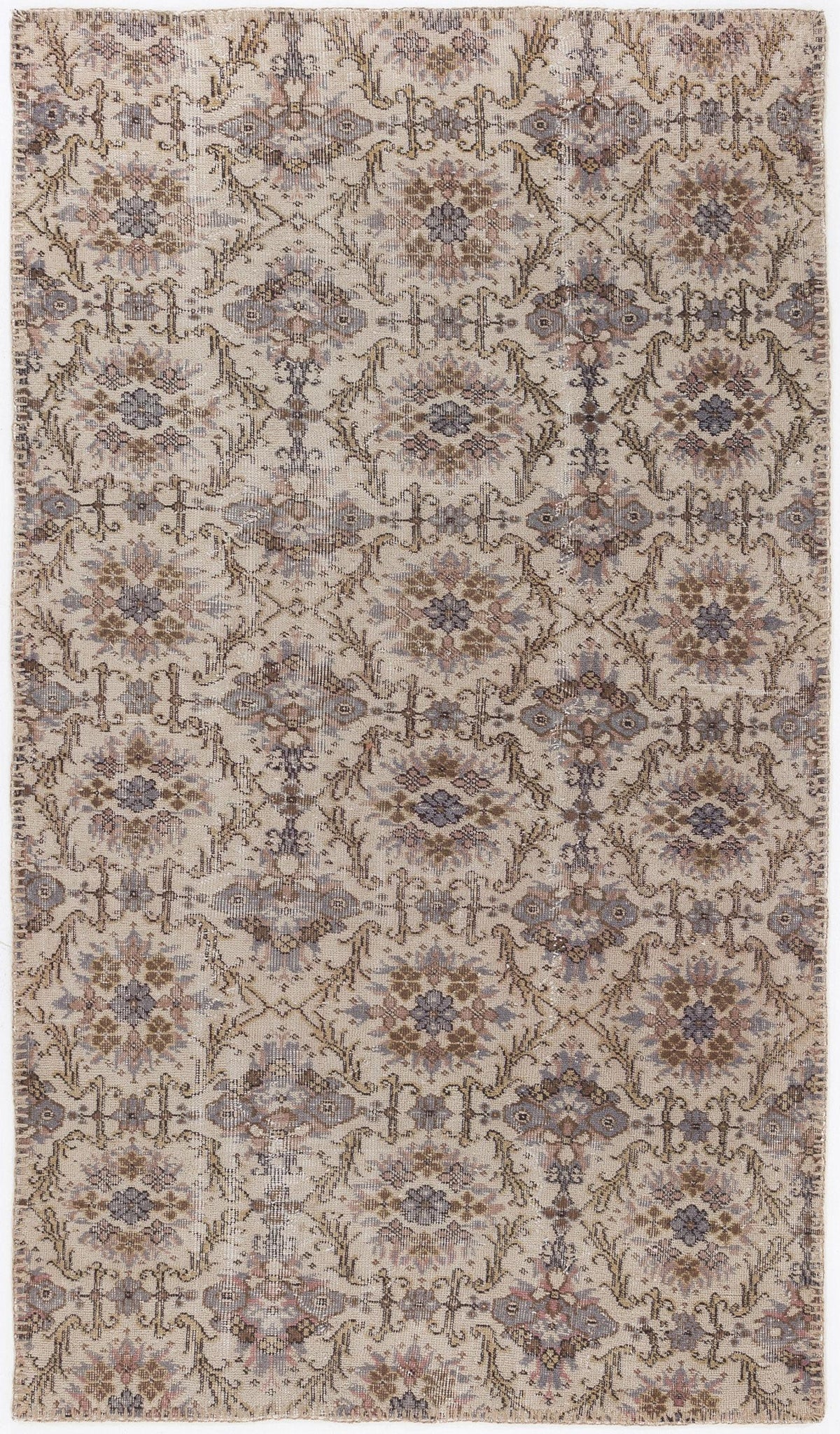 Beige and grey traditional rug with a repeating floral medallion pattern and distressed finish.
