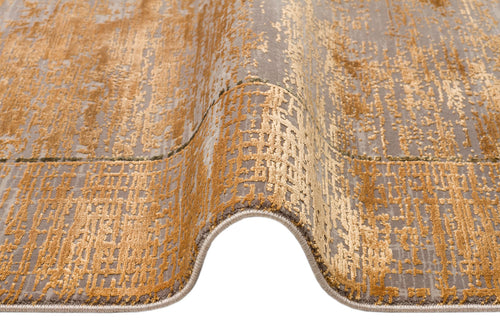 Load image 1 in gallery view. Gold and grey abstract distressed rug with a textured, grid-like pattern on a white background.