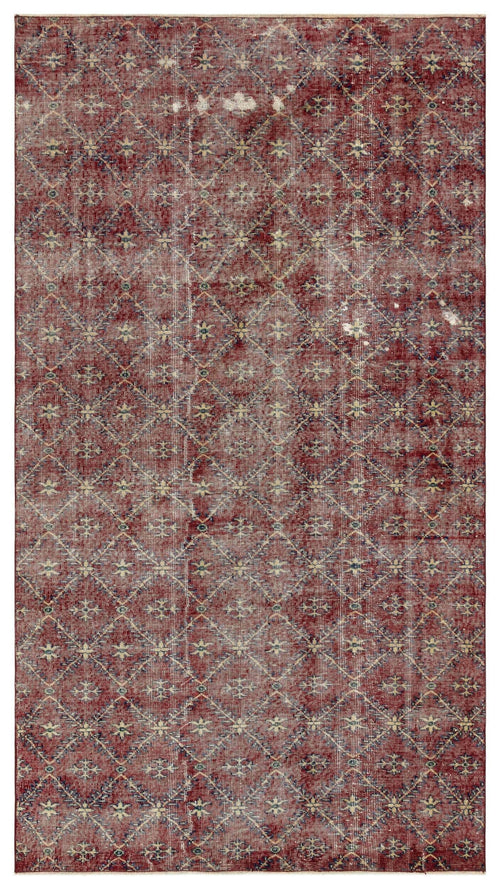 Load image 1 in gallery view. Distressed red rug with a repeating diamond lattice pattern and small floral motifs in blue and cream.