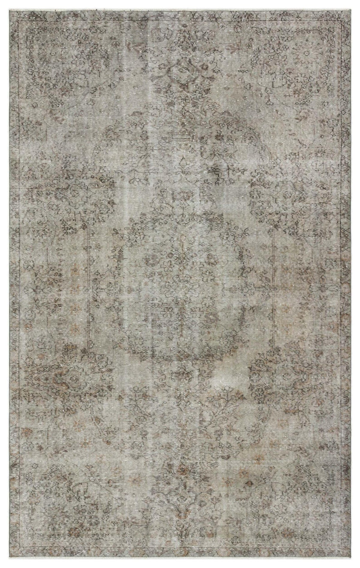 Grey and taupe distressed traditional rug with a faded central medallion and ornate border pattern.