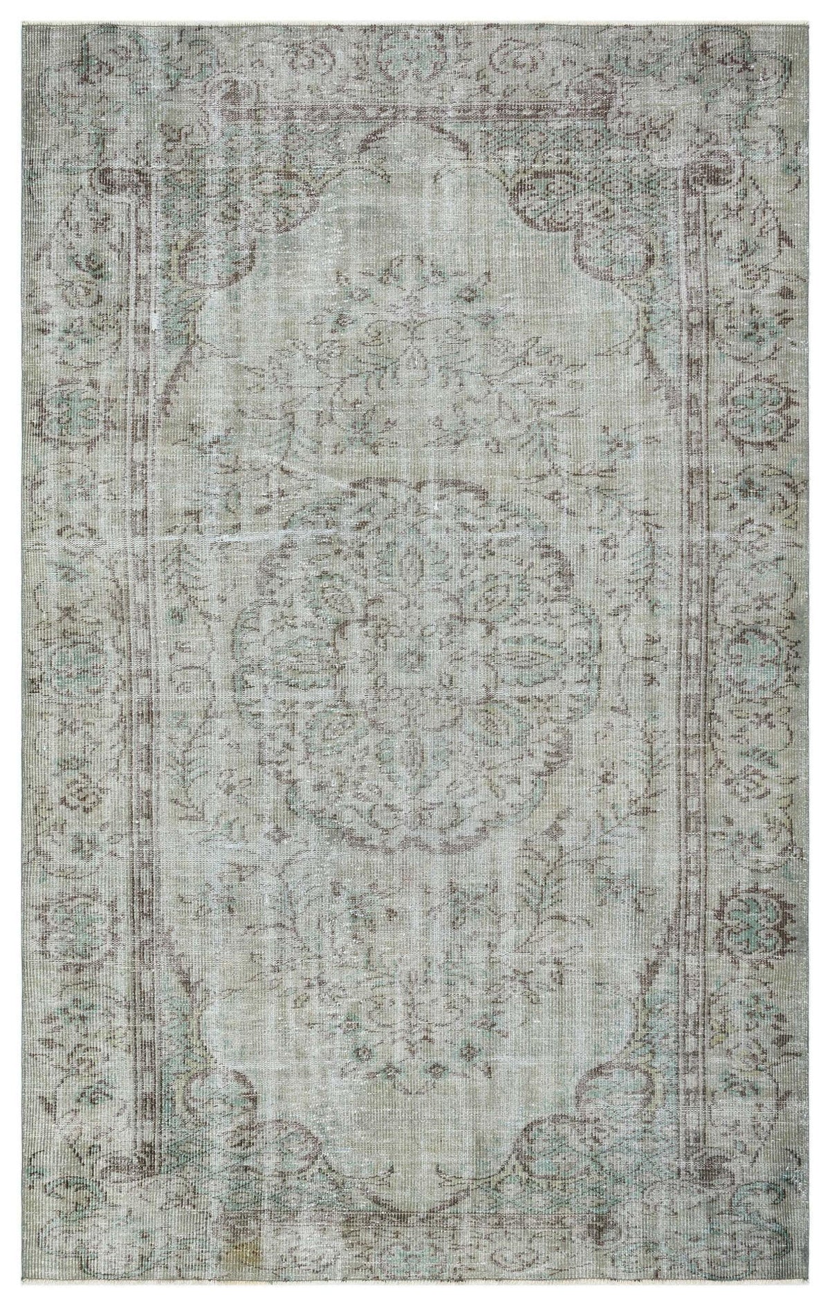 Distressed sage green and taupe rug with a traditional central medallion and ornate floral border.
