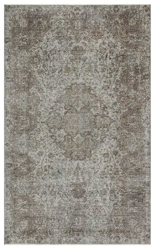 Load image 1 in gallery view. Grey and brown distressed traditional rug with a faded central medallion pattern on a white background.