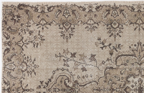 Load image 1 in gallery view. Beige and brown vintage-style rug with a distressed floral and paisley pattern.