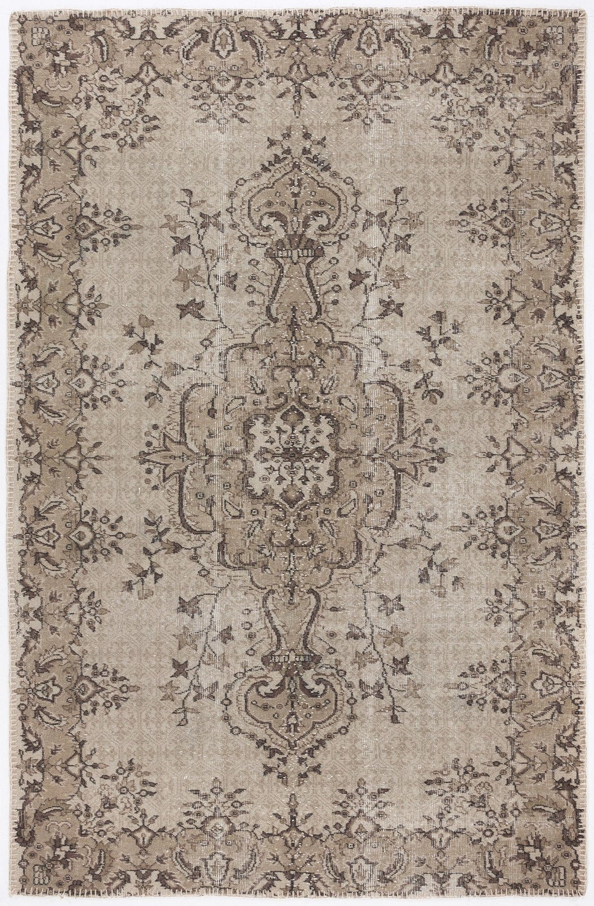 Taupe and dark brown distressed rug with a traditional central floral medallion and ornate border.