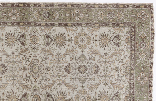 Load image 1 in gallery view. Sage green, brown, and cream traditional rug with a detailed floral medallion pattern and a decorative border.