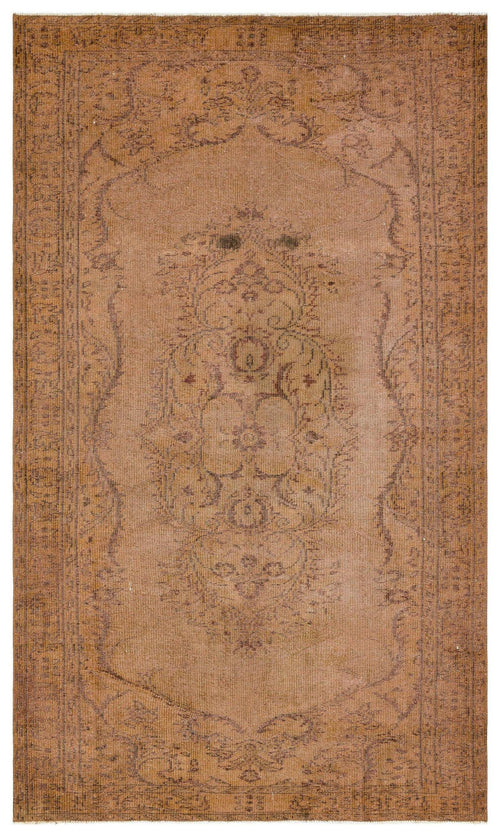 Load image 1 in gallery view. Distressed tan and brown rug with a central floral medallion and ornate border pattern.