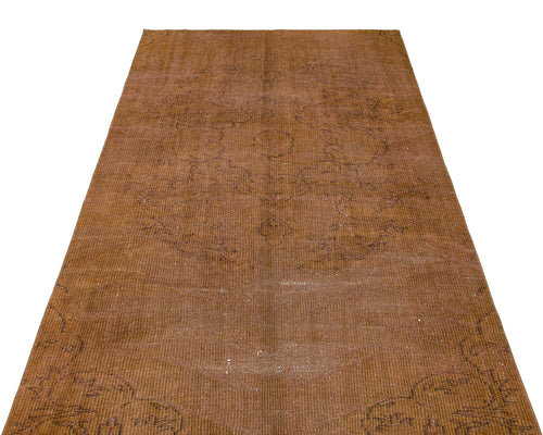 Load image 1 in gallery view. Solid brown vintage-style runner with a faint, distressed central medallion pattern.