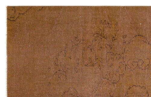 Load image 1 in gallery view. Distressed rust-brown rug with a faint, dark linear floral pattern and visible woven texture.