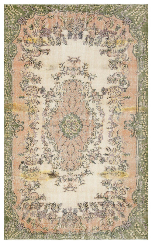 Load image 1 in gallery view. Distressed vintage-style rug with a central floral medallion, featuring muted green, peach, and cream tones.