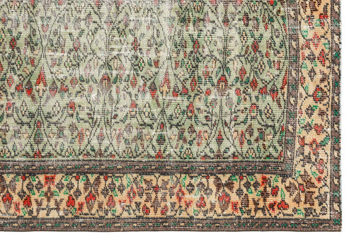 Load image 1 in gallery view. Sage green and beige traditional rug with a distressed floral medallion pattern and a dark brown decorative border.