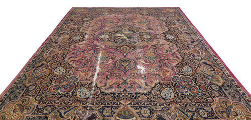 Load image 1 in gallery view. Pink and navy blue traditional Persian-style rug with an intricate floral medallion pattern on a white background.