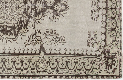 Load image 1 in gallery view. Beige and dark brown rug with a traditional ornate border and floral medallion pattern.