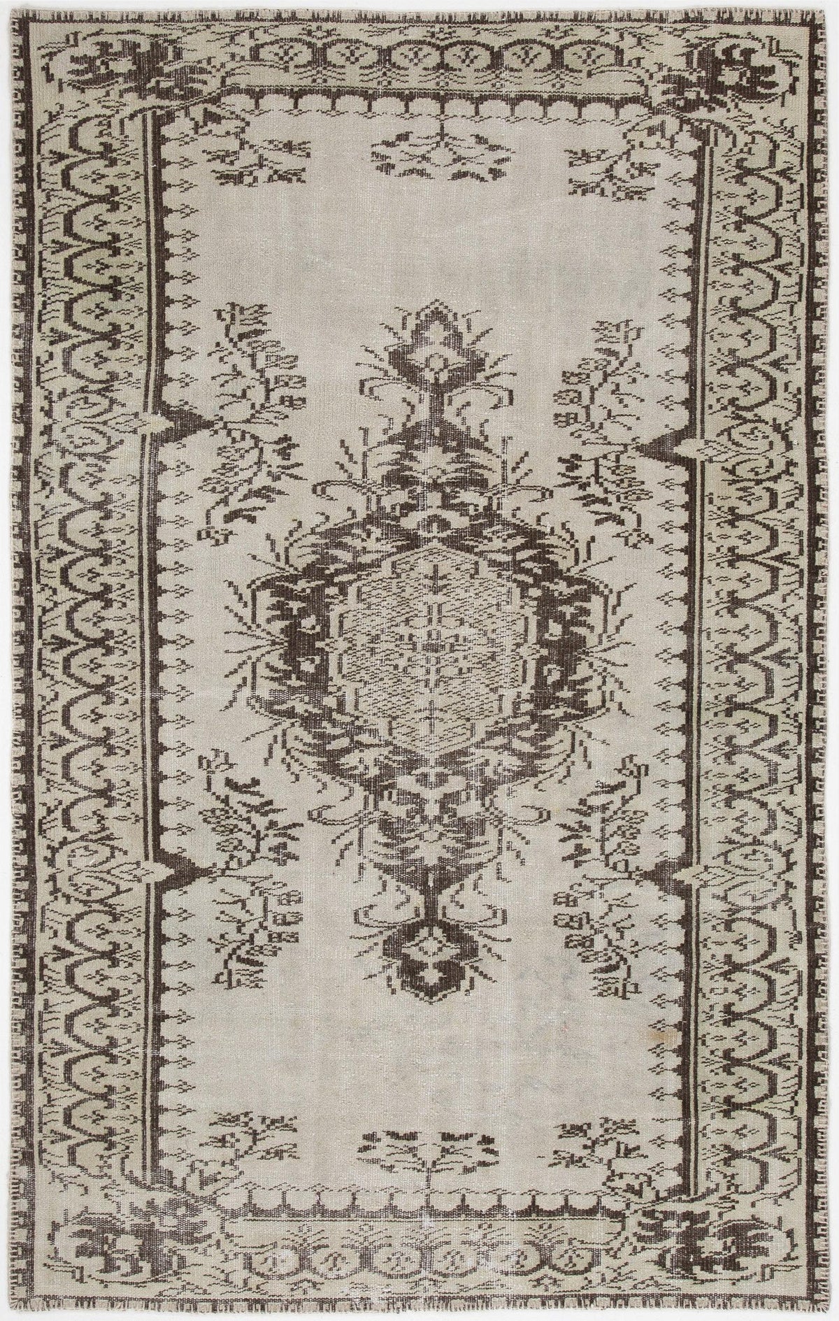 Beige and dark brown vintage-style rug with a central medallion and ornate geometric border.